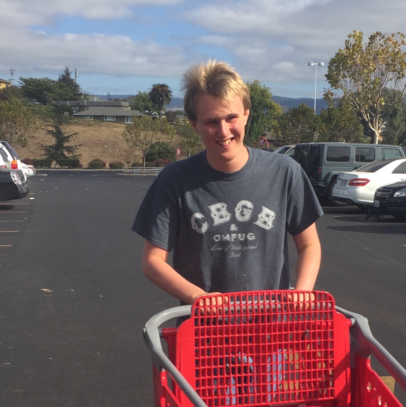 A student pushing a shopping cart
